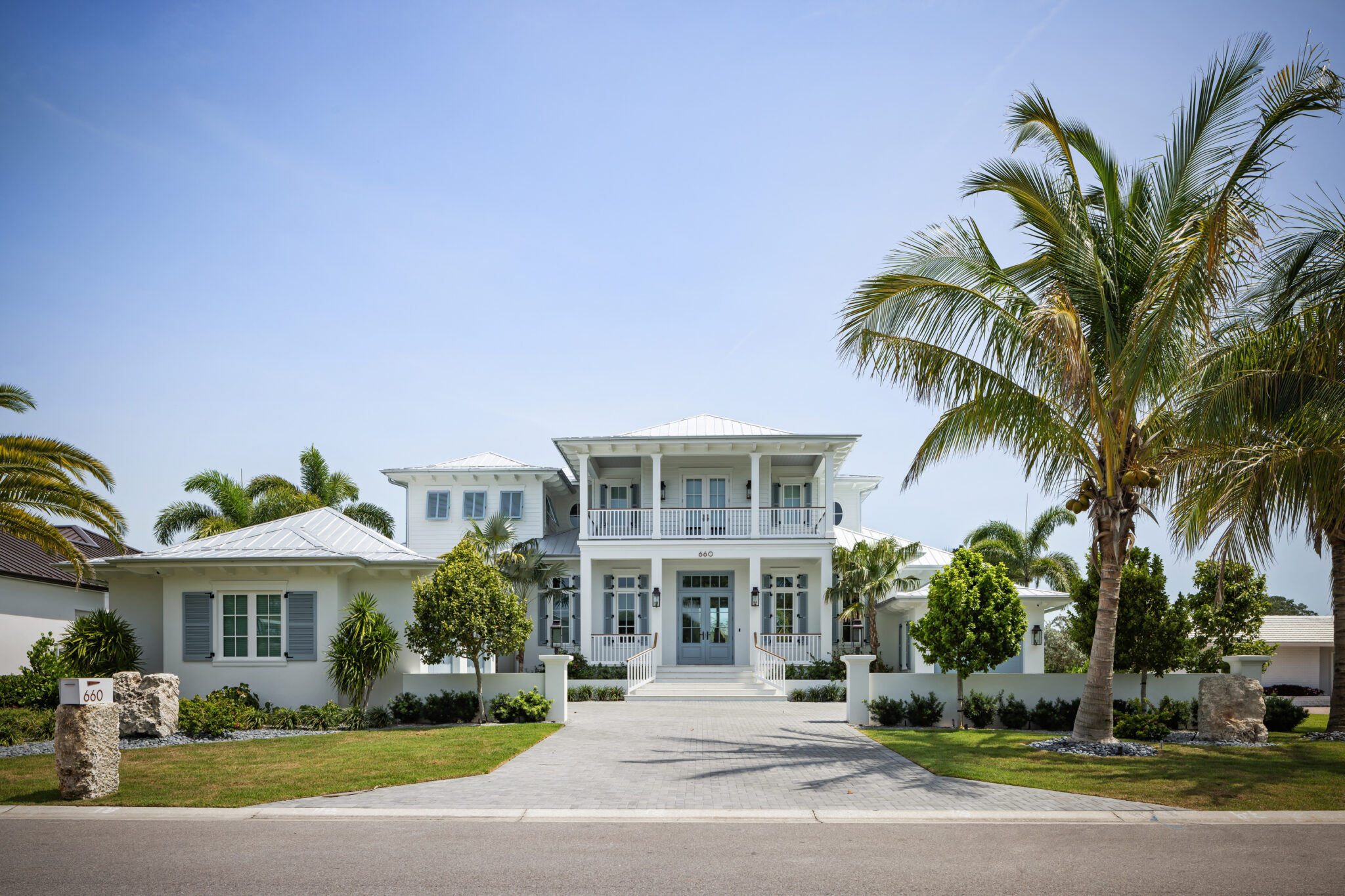 Harbor House from the street with palms and landscaping