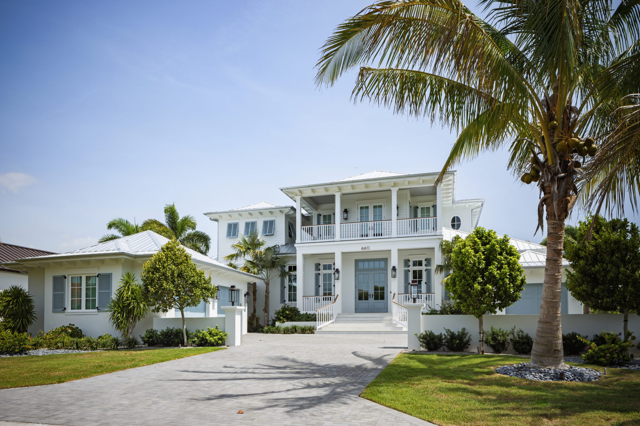 Front of Harbor House with the paver drive and garage wing