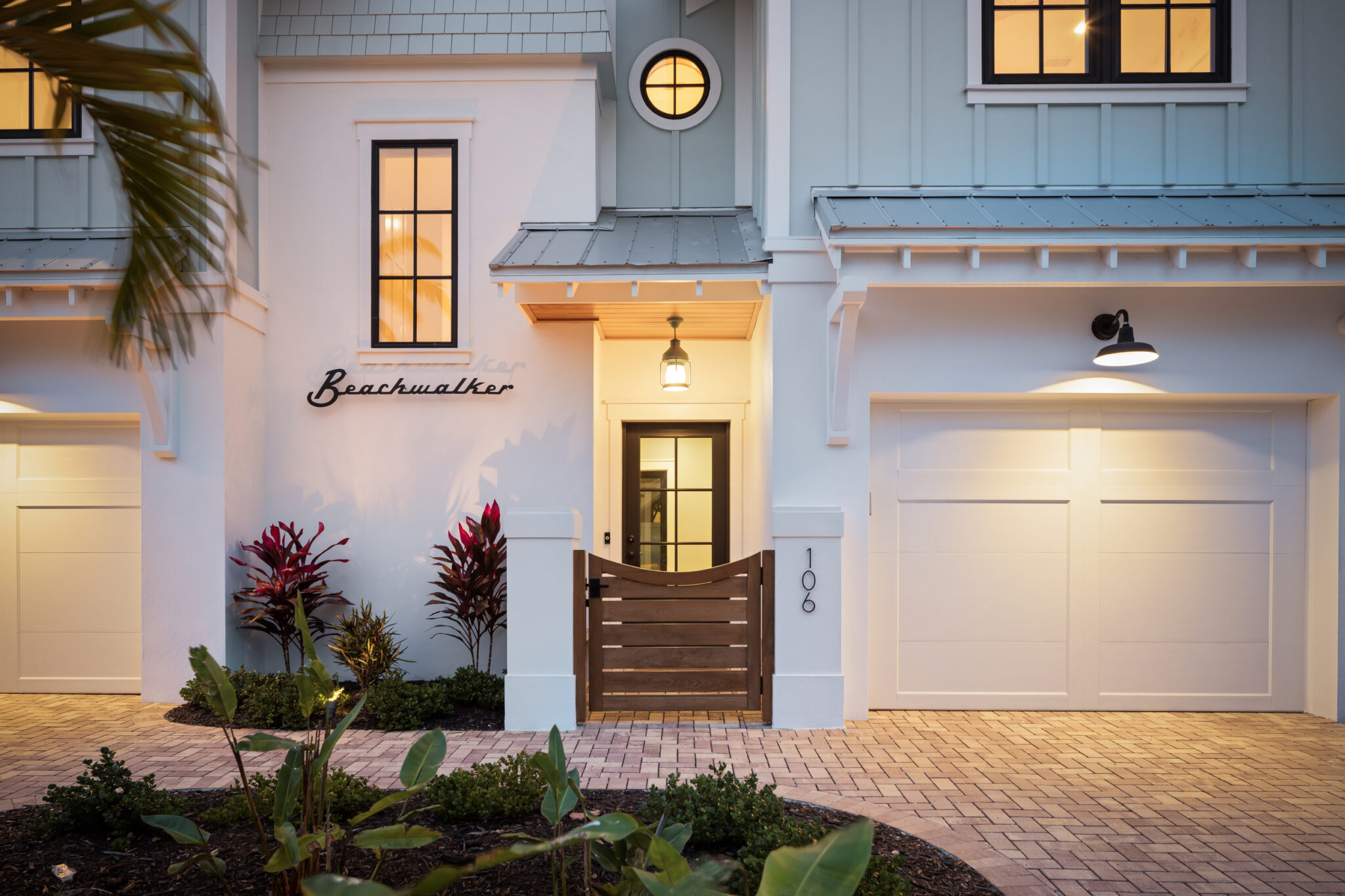 Front entry with a slatted wood gate and the Beachwalker name sign