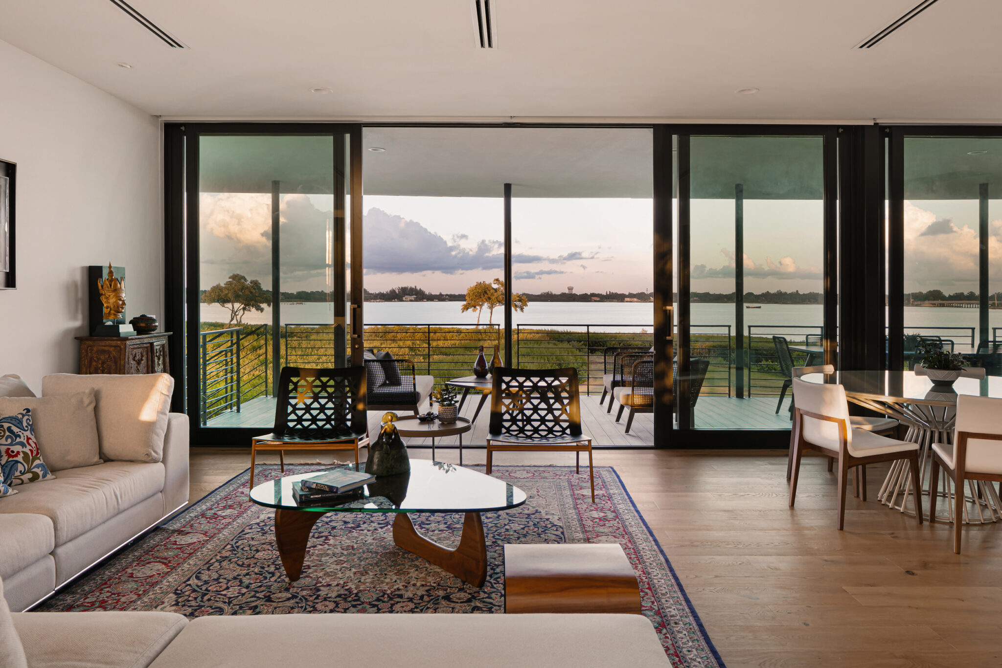 Great room with bay views through floor-to-ceiling glass