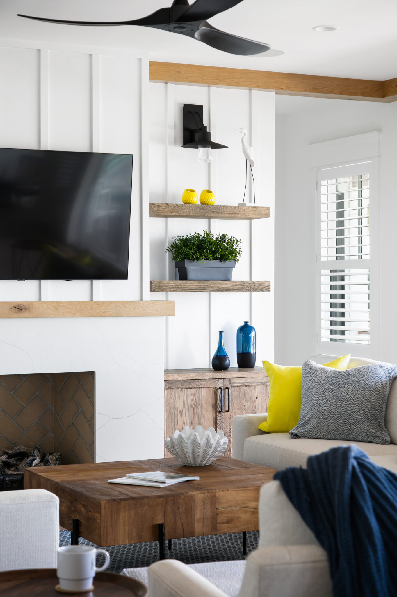 Fireplace wall with shiplap and floating shelves