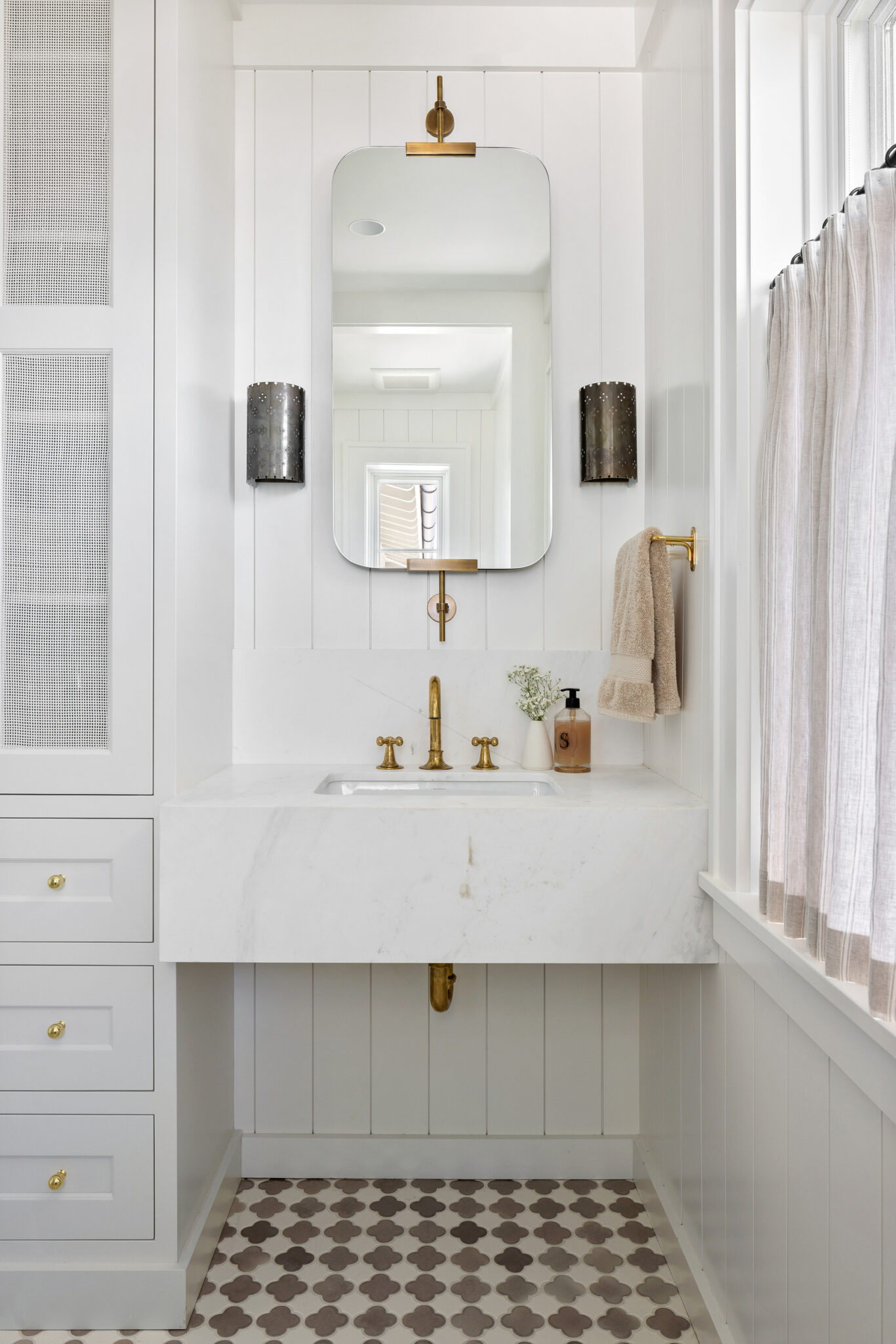 Powder room with a white vanity and checkerboard floor