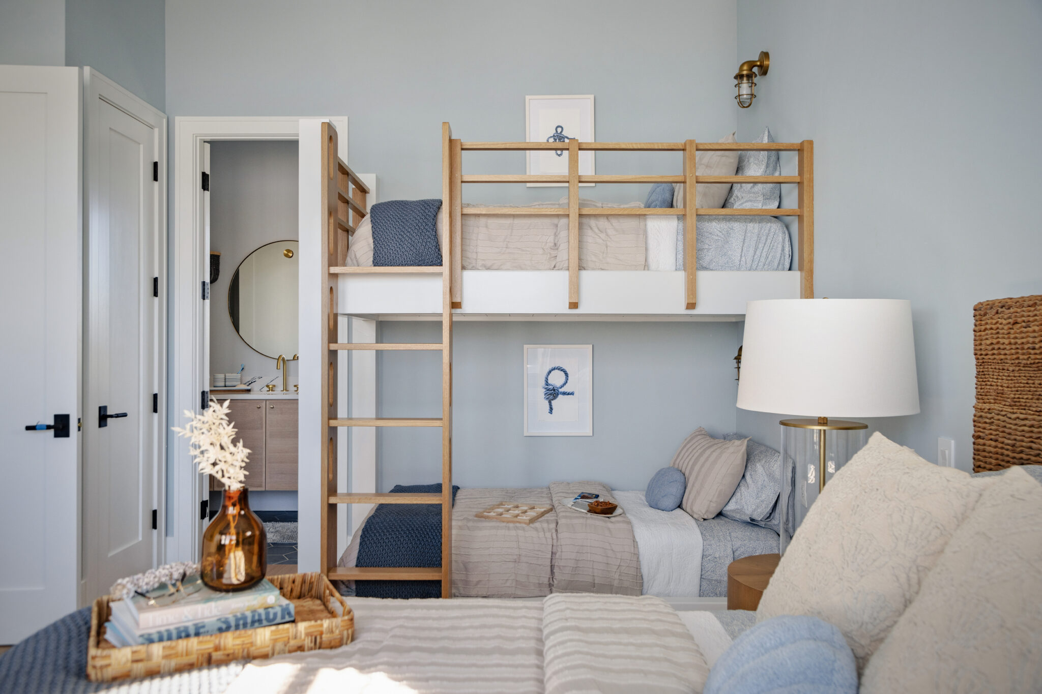 Bunk room with built-in bunks and a ladder