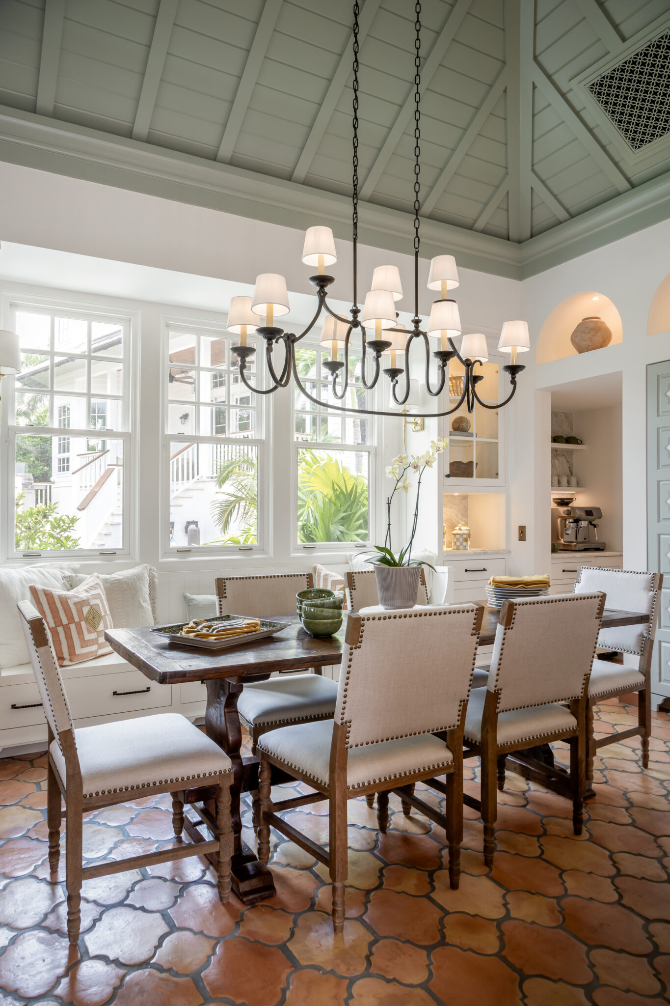 Breakfast room with a chandelier and a green painted ceiling