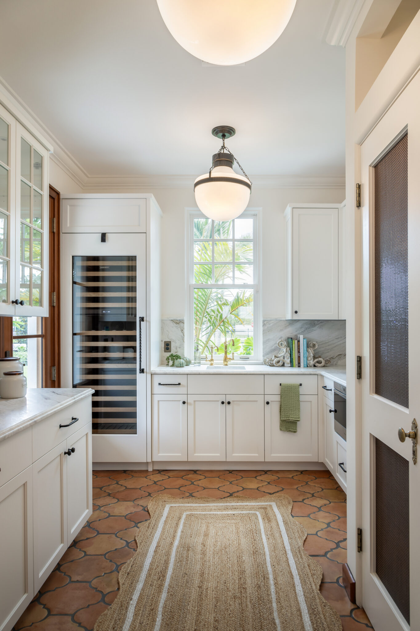 Butler's pantry with a wine fridge and runner rug