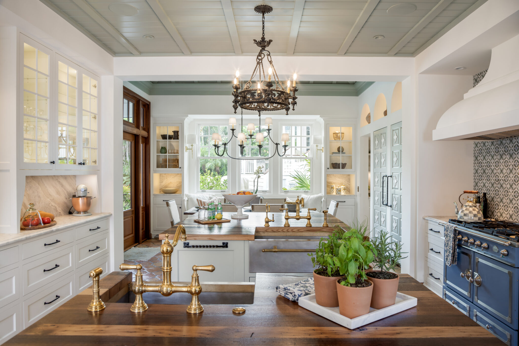 Kitchen seen across the island toward the windows