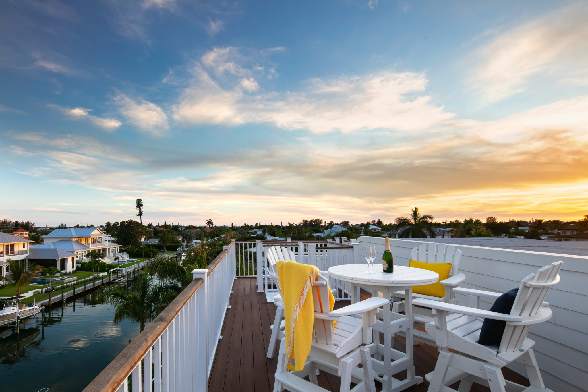 Rooftop deck table overlooking the canal at sunset