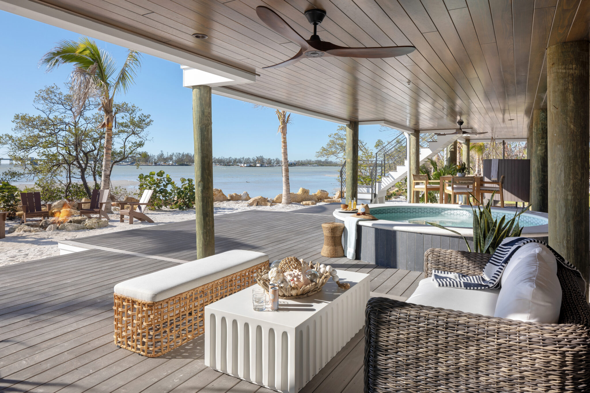 Covered porch lounge looking over the beach and bay
