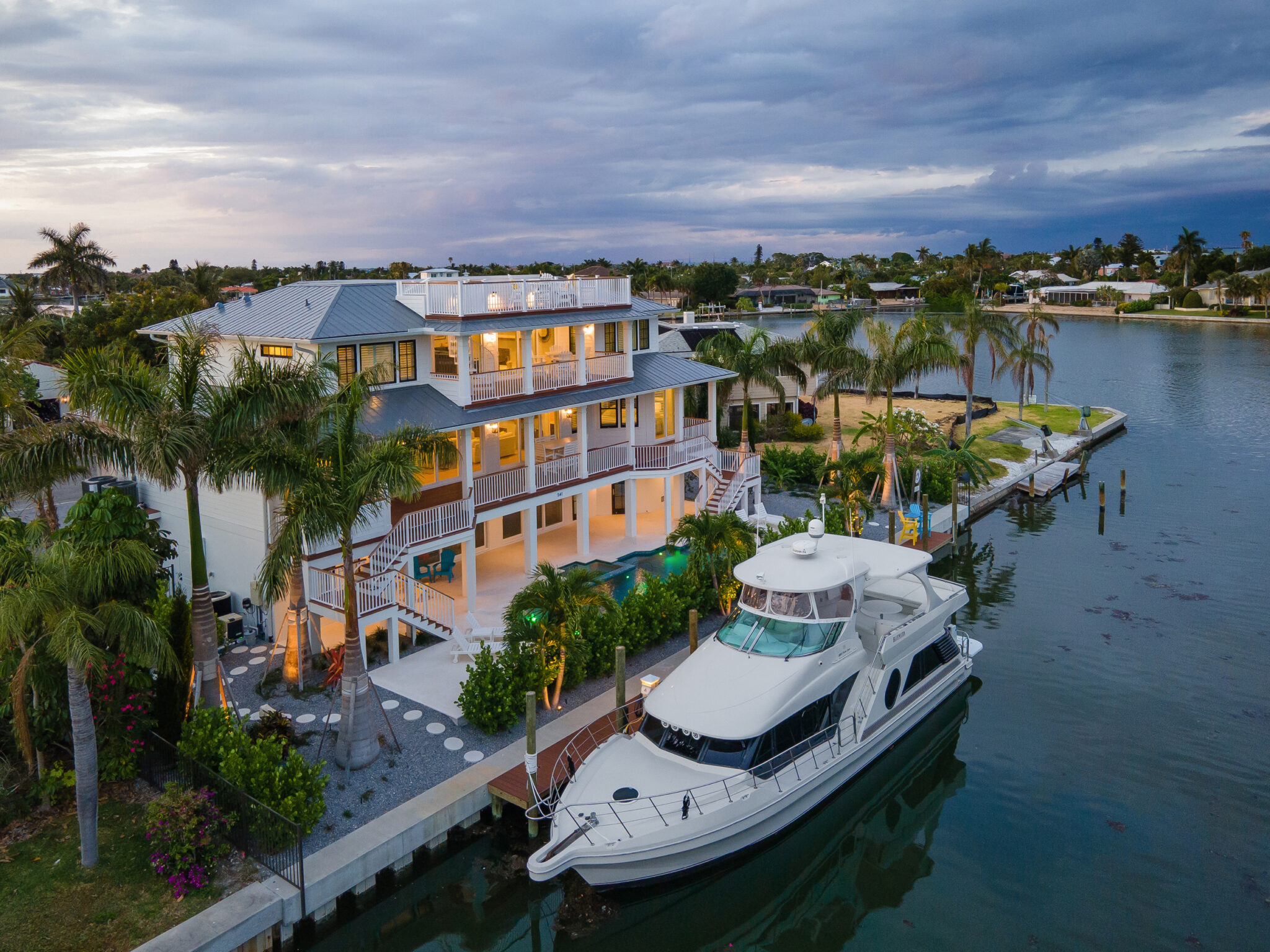 Aerial of Coastal Haven and its dock on a Holmes Beach canal