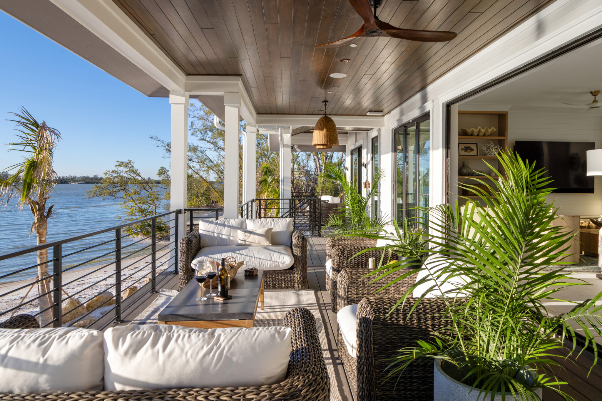 Covered porch seating facing the water