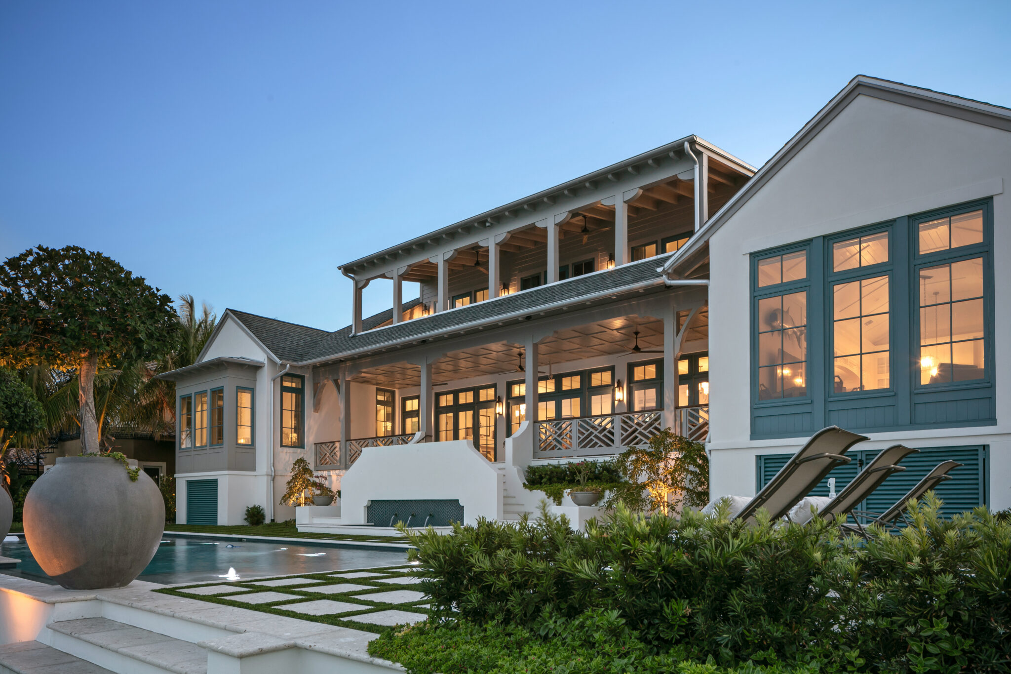 Rear porches and pool of Blue Heron with blue-trimmed windows