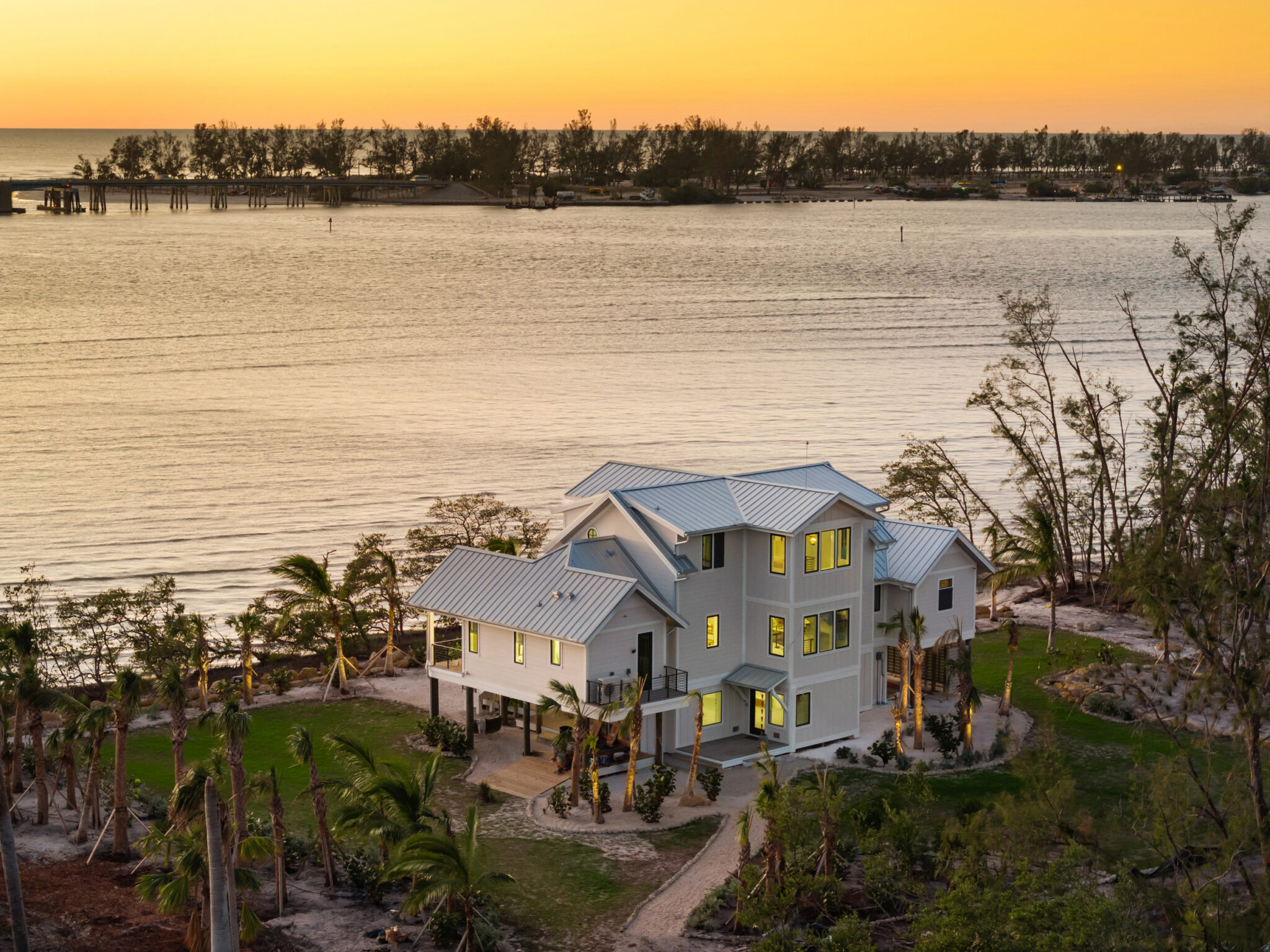 Aerial of the elevated home on Jewfish Key at sunset