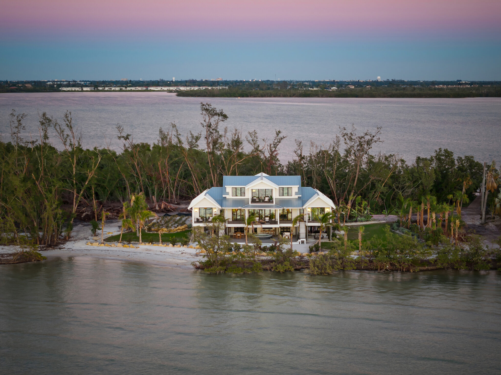 Aerial of Jewfish Key with the house set among trees and beach