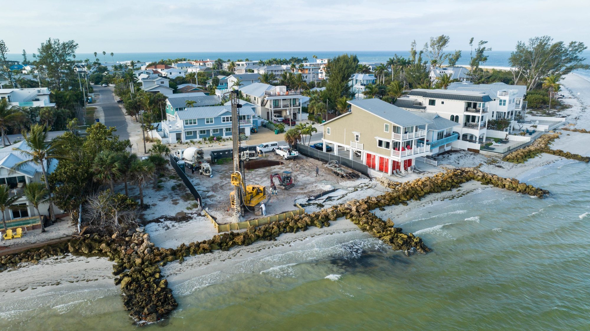 Aerial view from Tampa Bay of the pile rig and concrete truck on the waterfront lot