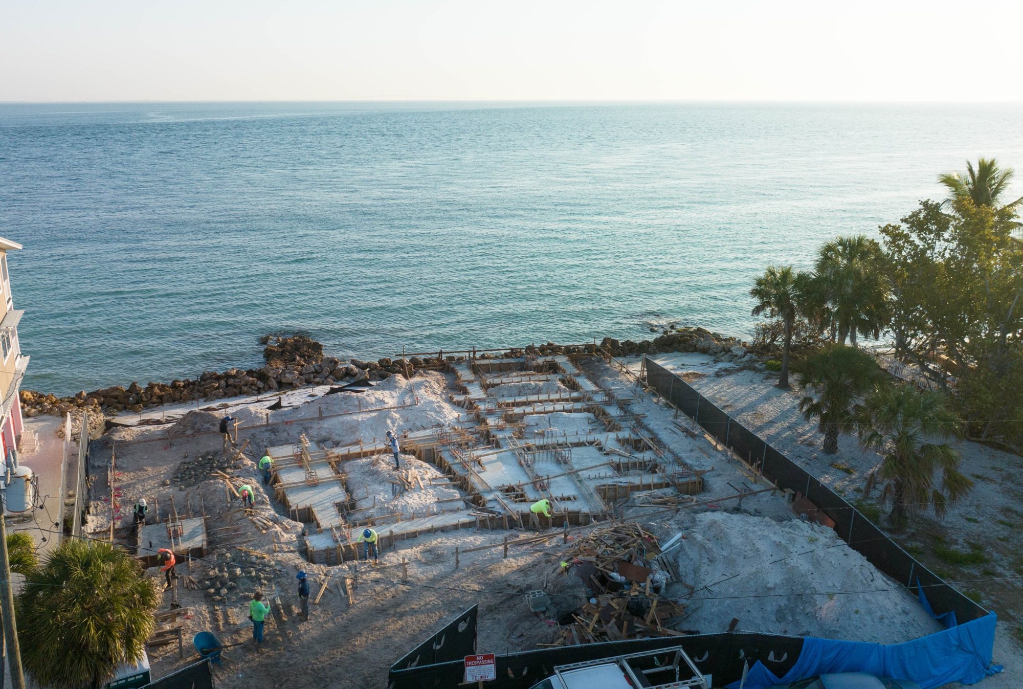 Aerial view of the crew forming and tying the foundation, with Tampa Bay beyond