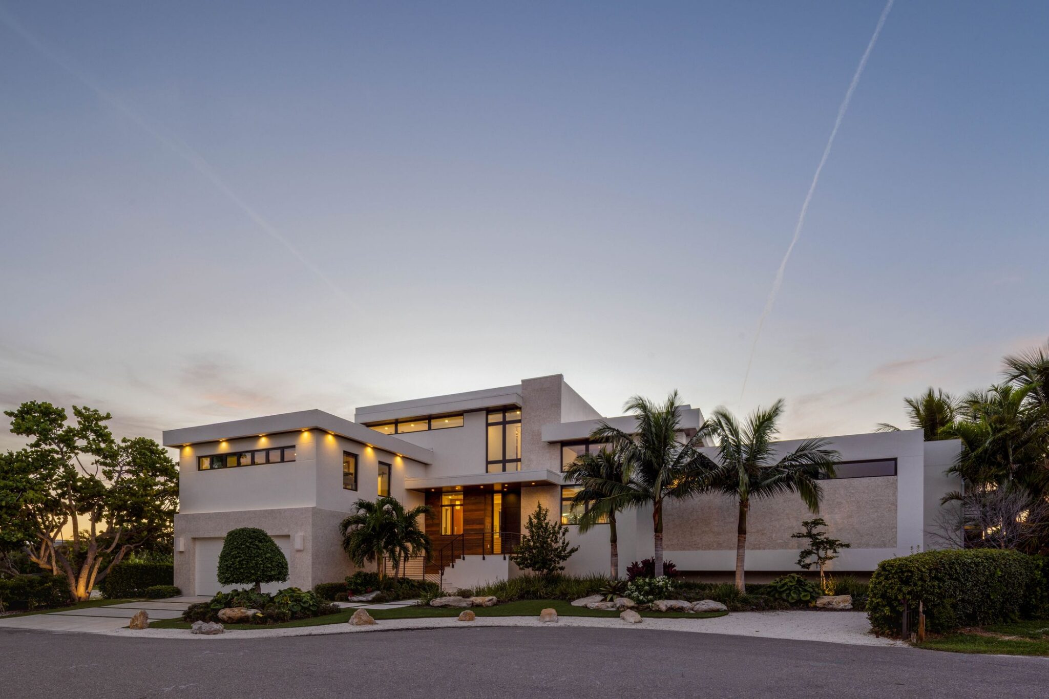 Street front of Bayview Residence at twilight with lit soffits and entry