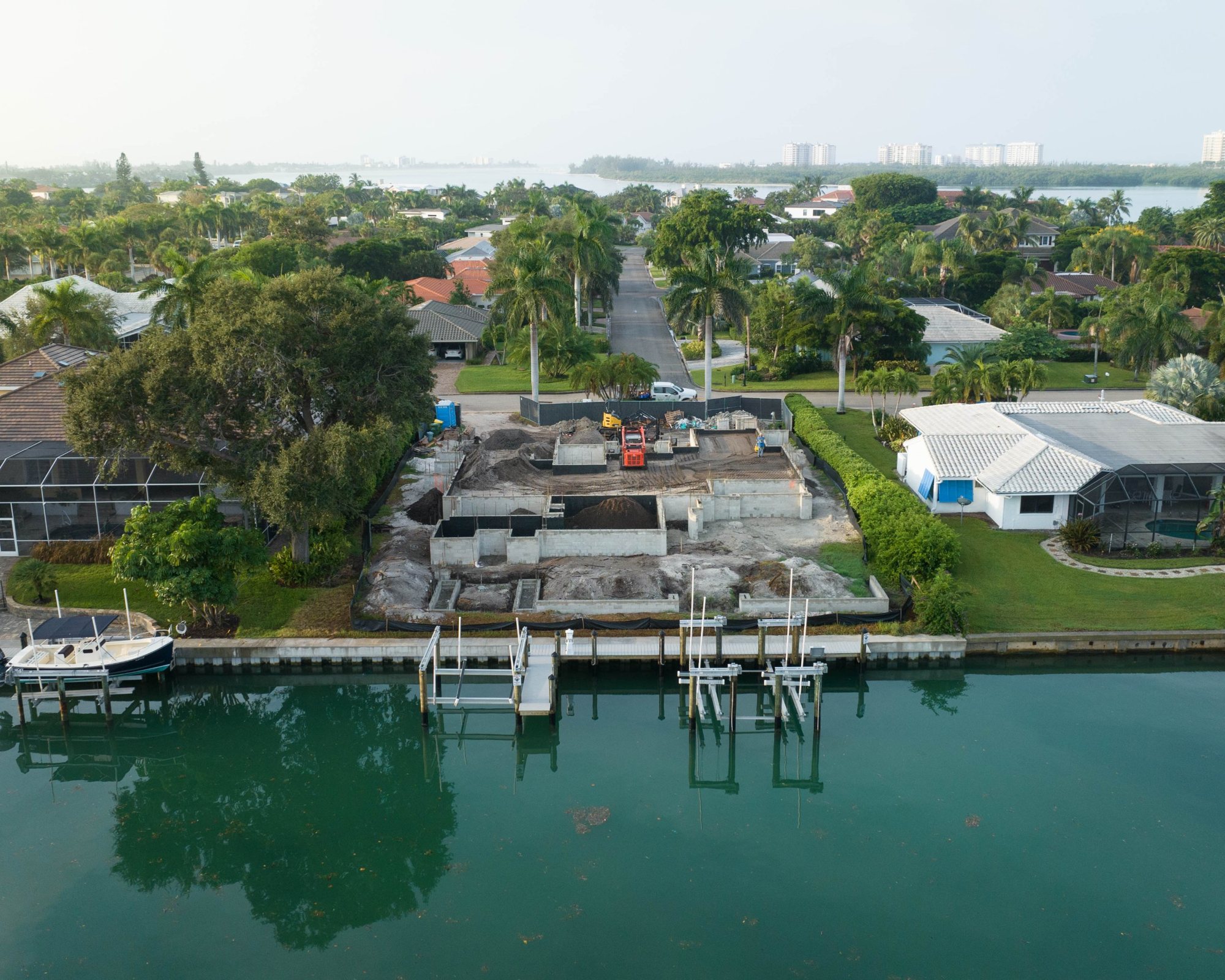Aerial view straight on from the canal of the stem walls and the new dock and lifts