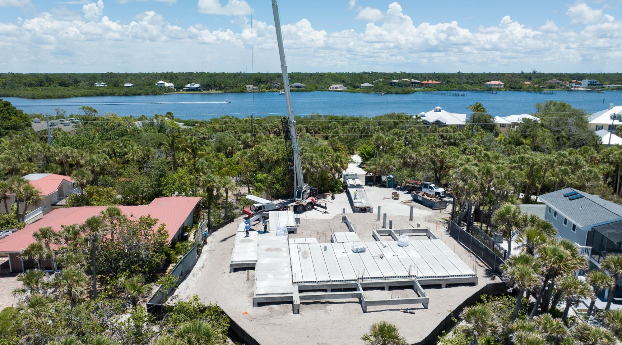 Aerial view of precast floor planks being set, with Lemon Bay beyond