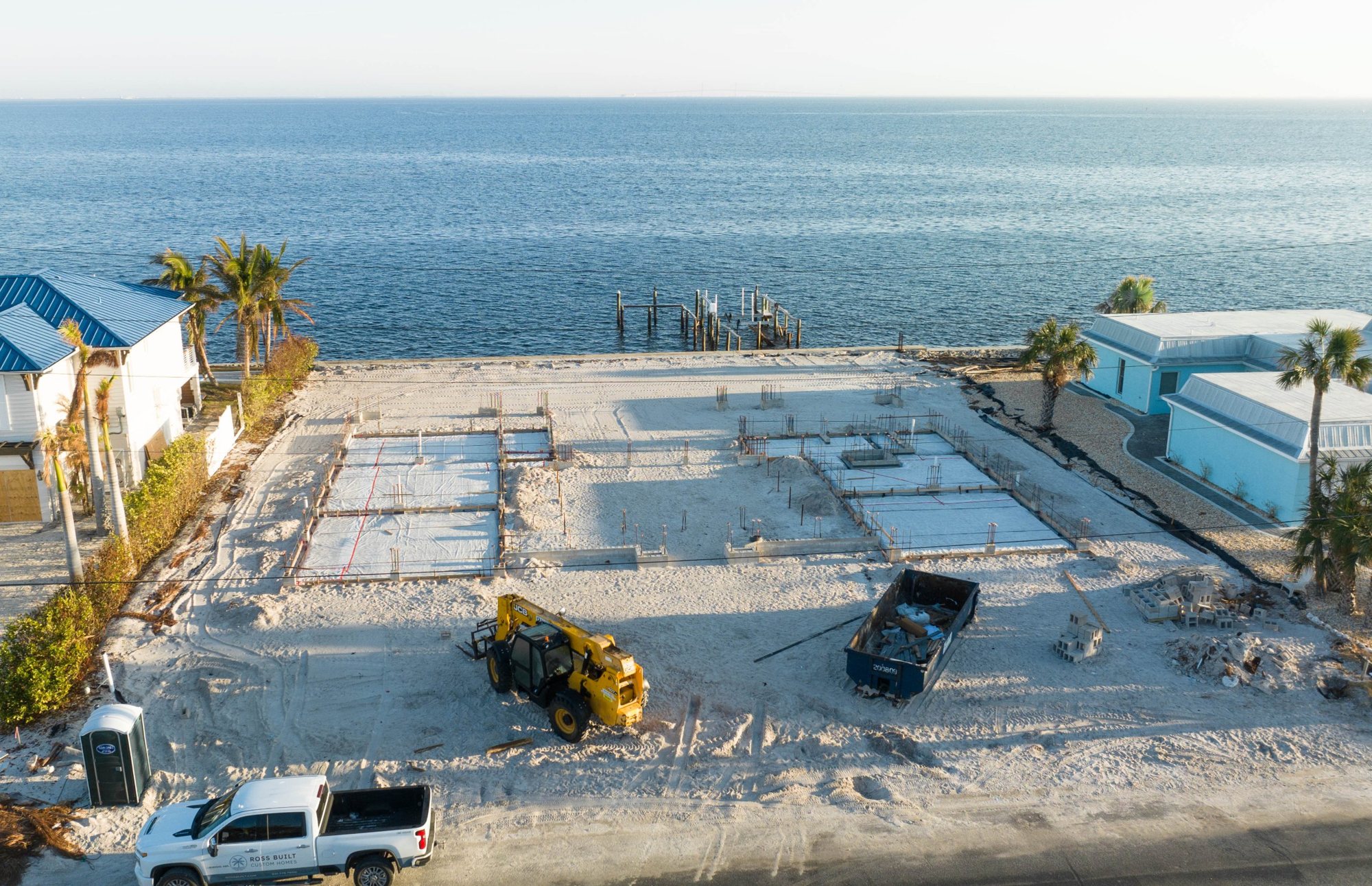 Aerial view from the street of the foundation forms, with Tampa Bay beyond