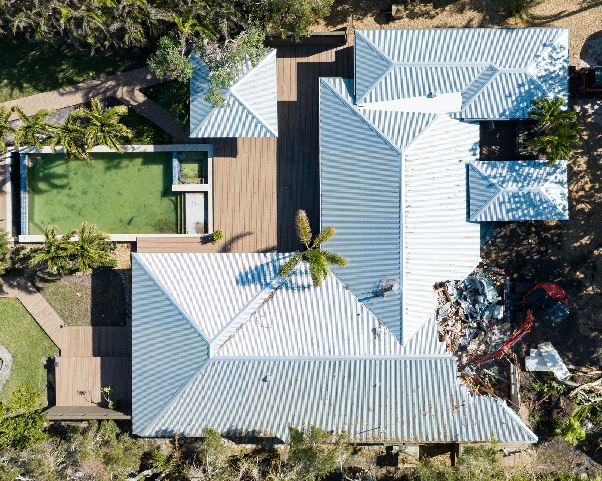 Aerial view of the existing house coming down at the start of the project