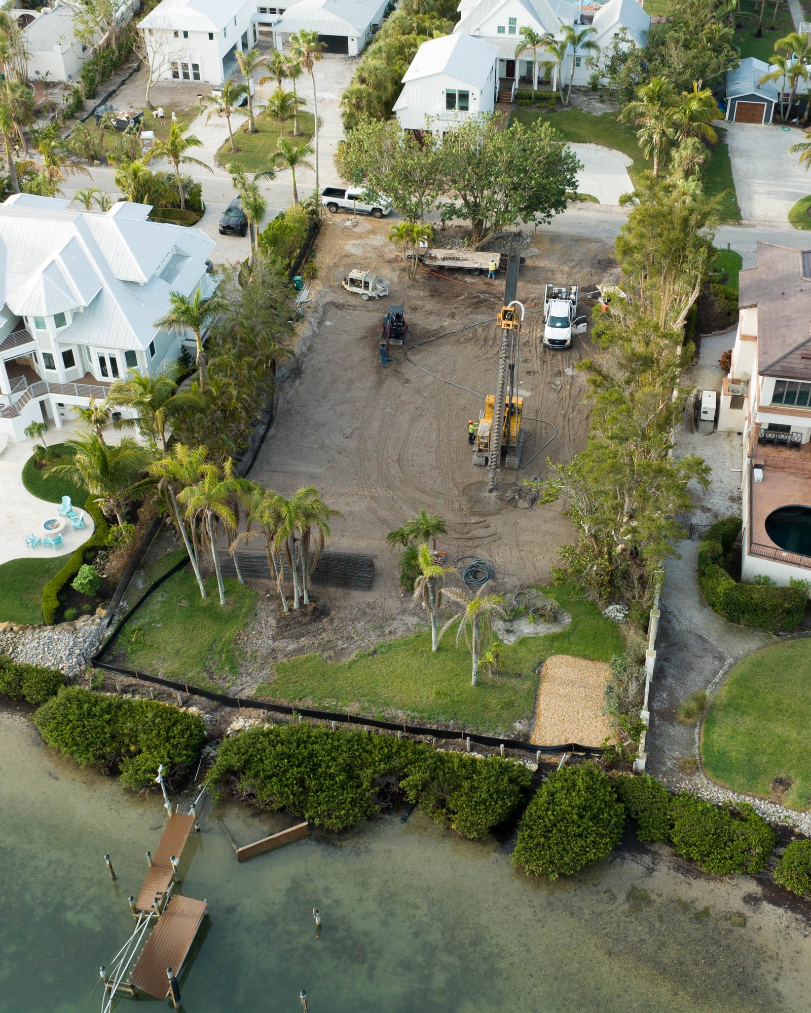 Aerial view of the foundation piles going in, with the bay and mangroves beyond