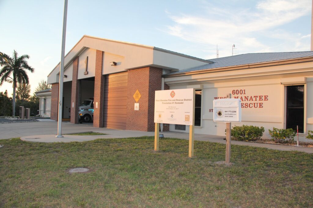 West Manatee Fire Rescue Station 1 in Holmes Beach during its remodel by Ross Built, with the project sign and Ross Built document box out front, 2011